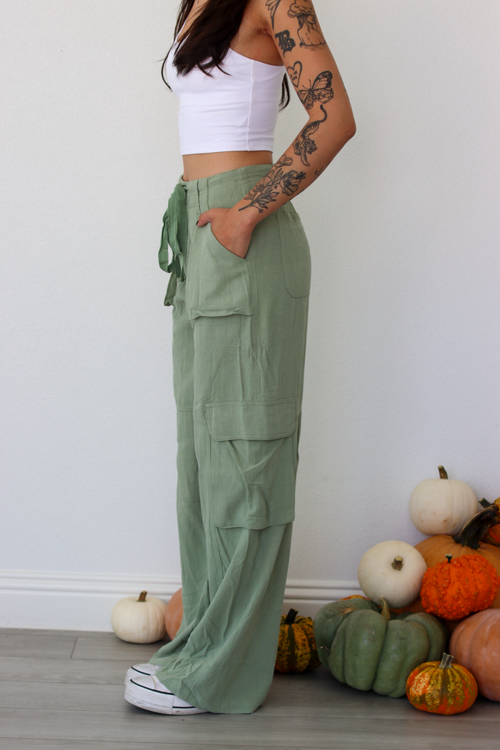Woman wearing green wide leg cargo pants