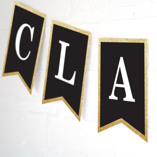 Celebrate graduation banner with a black background, white text (customizable) and gold glitter edging.