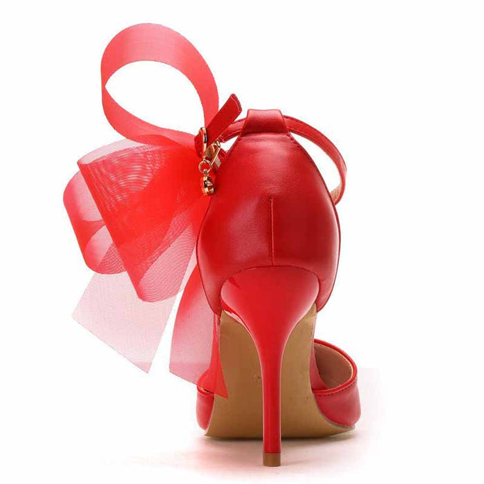 Red bridal closed toe high heel sandals with a decorative bow at the heel for elegant weddings