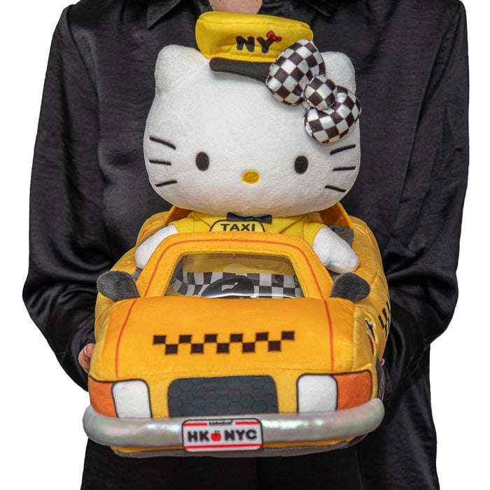 Hello Kitty® NYC Taxi plush toy by Sanrio featuring Hello Kitty in a yellow NYC taxi, debuting at NYCC 2025.
