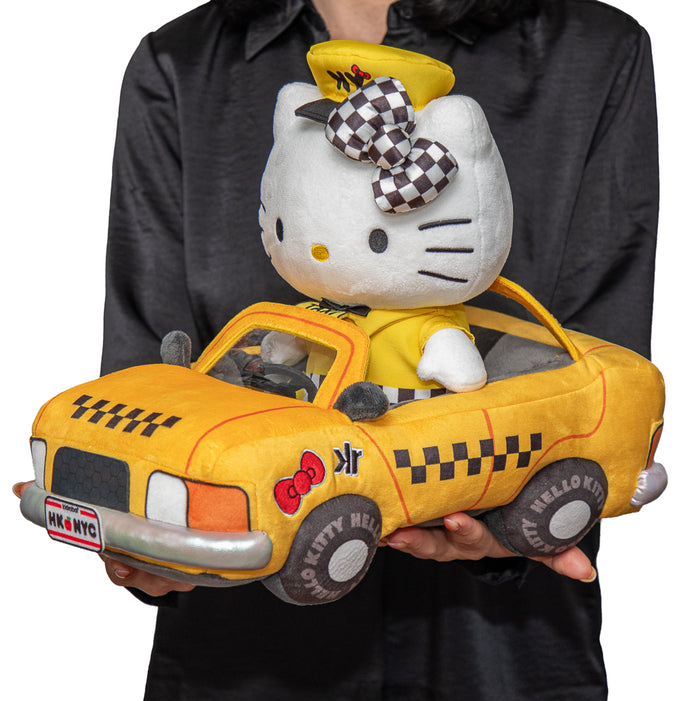 Sanrio Hello Kitty plush in NYC taxi design, debut at NYCC, soft and cuddly toy featuring iconic character and city scene.