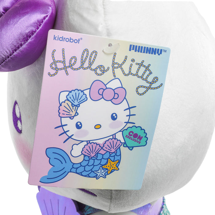 Sanrio Hello Kitty® purple mermaid plush toy with detailed mermaid tail and cheerful expression, soft and cuddly for kids.