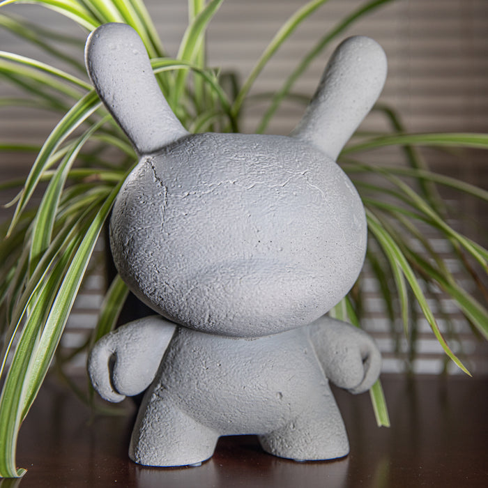 Kidrobot RAW 8-inch Concrete Dunny figure, limited edition collectible toy with a textured concrete finish and artistic design.