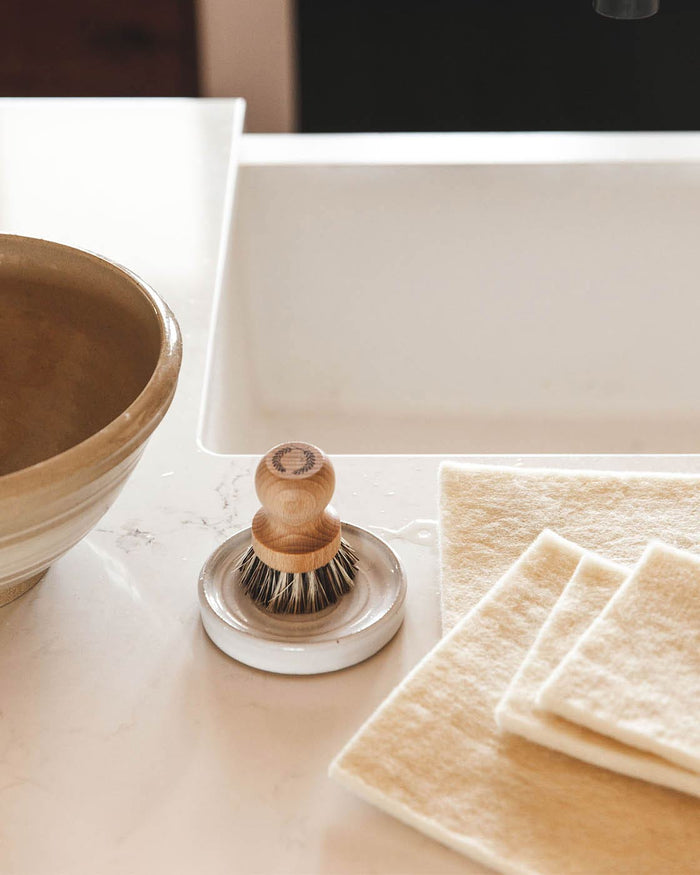 Laurel Pot Brush and Stoneware Rest — brush and rest beside a kitchen sink; Farmhouse Pottery