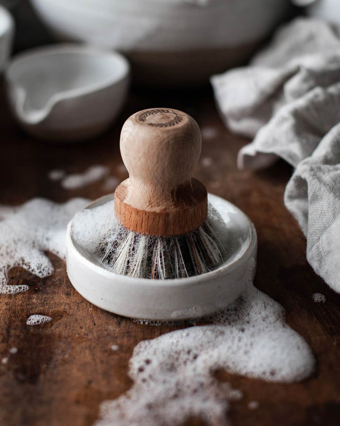 Laurel Pot Brush and Stoneware Rest — brush and rest beside soapy pottery; Farmhouse Pottery