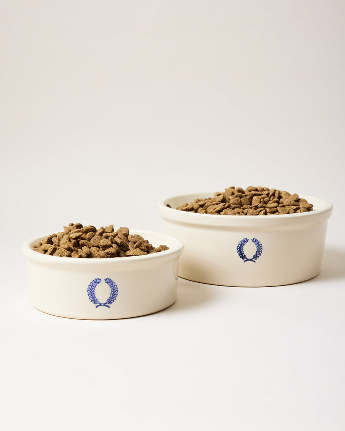 Laurel Stoneware Dog Bowl — two blue-laurel dog bowls with kibble; Farmhouse Pottery