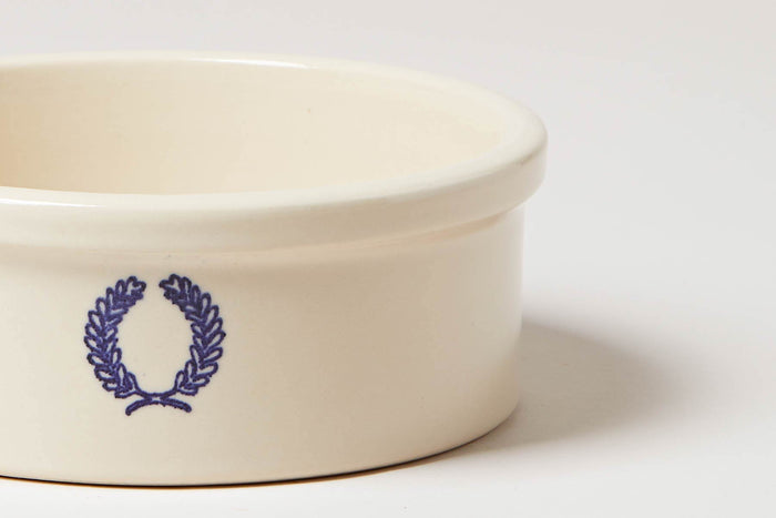 Laurel Stoneware Dog Bowl — close view of blue laurel emblem and rim; Farmhouse Pottery