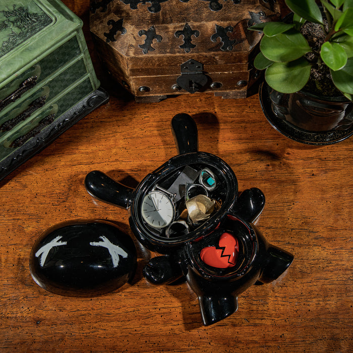 Kidrobot L.I.E. Dunny ceramic ashtray in Burned Edition with artistic design, exclusive collectible featuring Dunny character artwork.