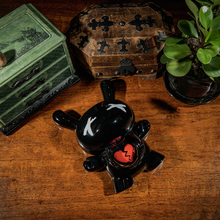 Kidrobot L.I.E. Dunny ceramic ashtray in burned edition, featuring a stylized Dunny design with detailed artwork on the ceramic surface.
