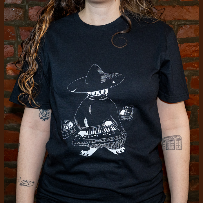 Model wearing Maestro (keys wizard) graphic t-shirt from Cryptid Records in black