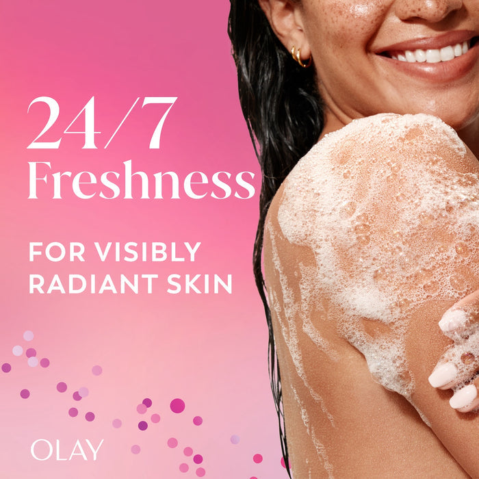 Model posing lathering body wash on arm. 24/7 Freshness for visibly radiant skin