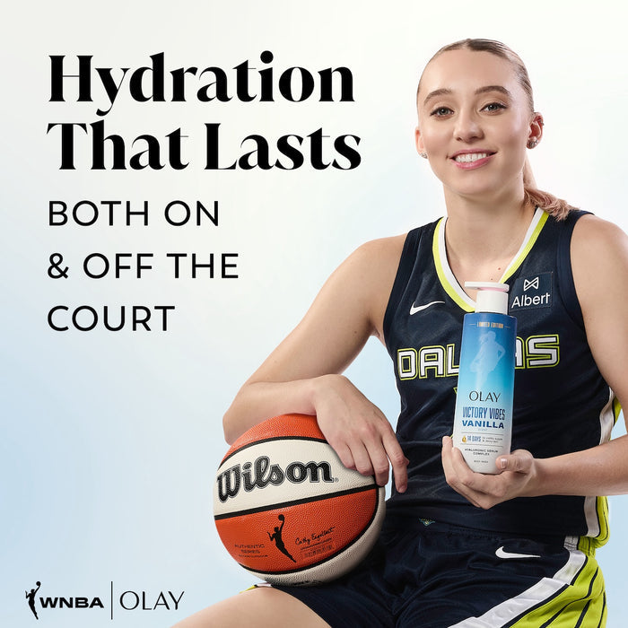 WNBA Player Paige Bueckers posing holidng a basketball and Victory Vibes ntensely Hydrating Body Wash. Hydration that lasts. Both on and off the court