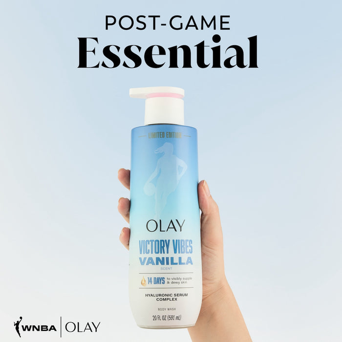 Model holding Victory Vibes ntensely Hydrating Body Wash. Post game essential