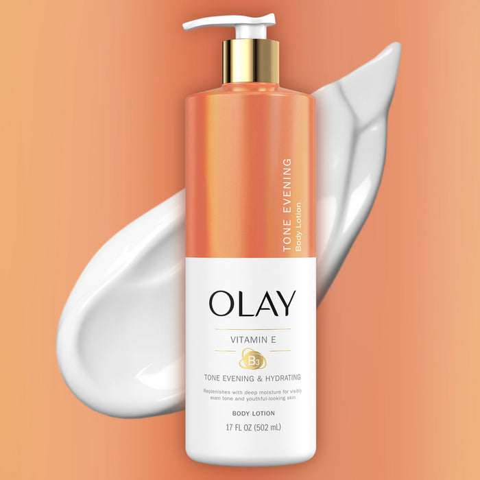 Olay body lotion bottle with pump on an orange background