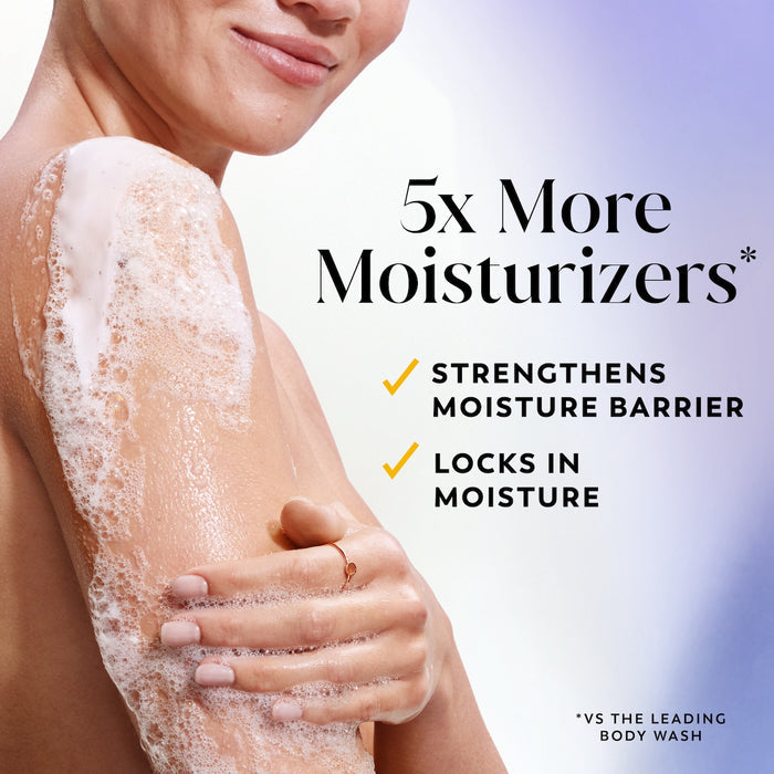Model posing lathering arm with body wash. 5x more moisturizers* Strengthens moisture barrier. Locks in moisture. *vs the leading body wash.