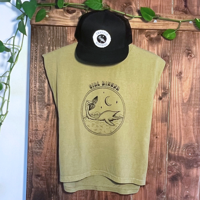 Plesia Girl Dinner muscle tank hanging with a Cryptid Records logo trucker hat