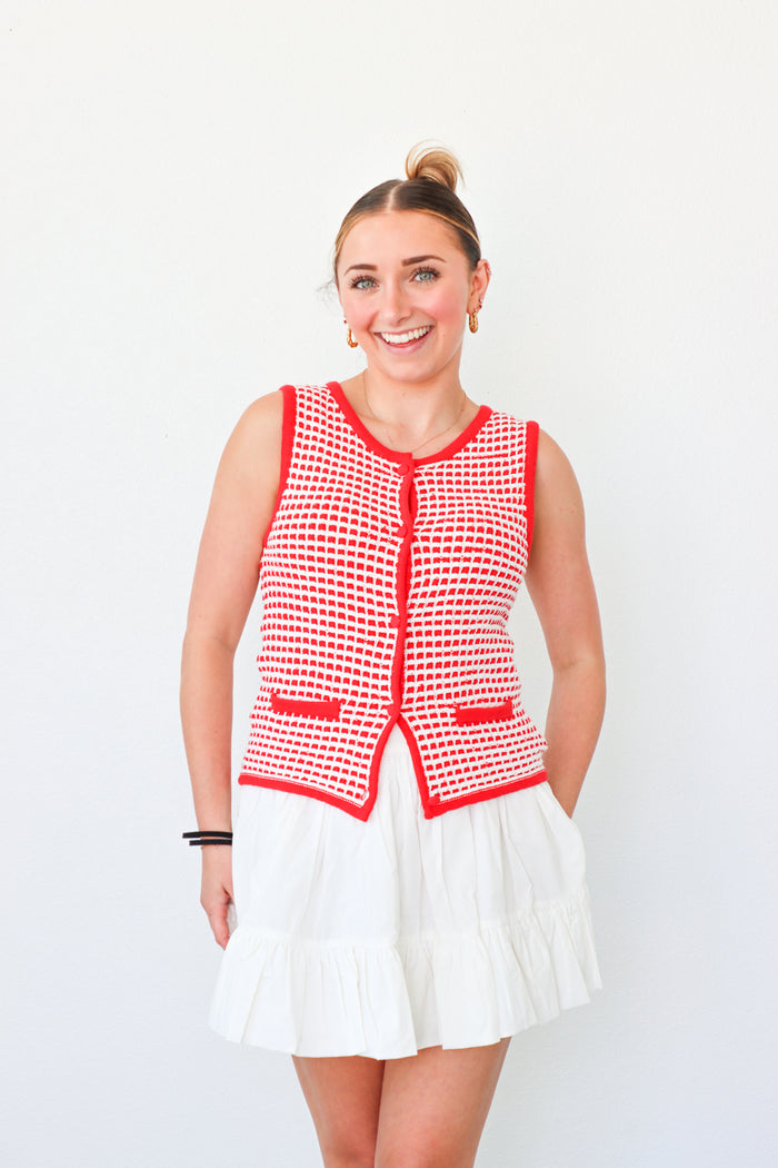 girl wearing red button down knit tank top