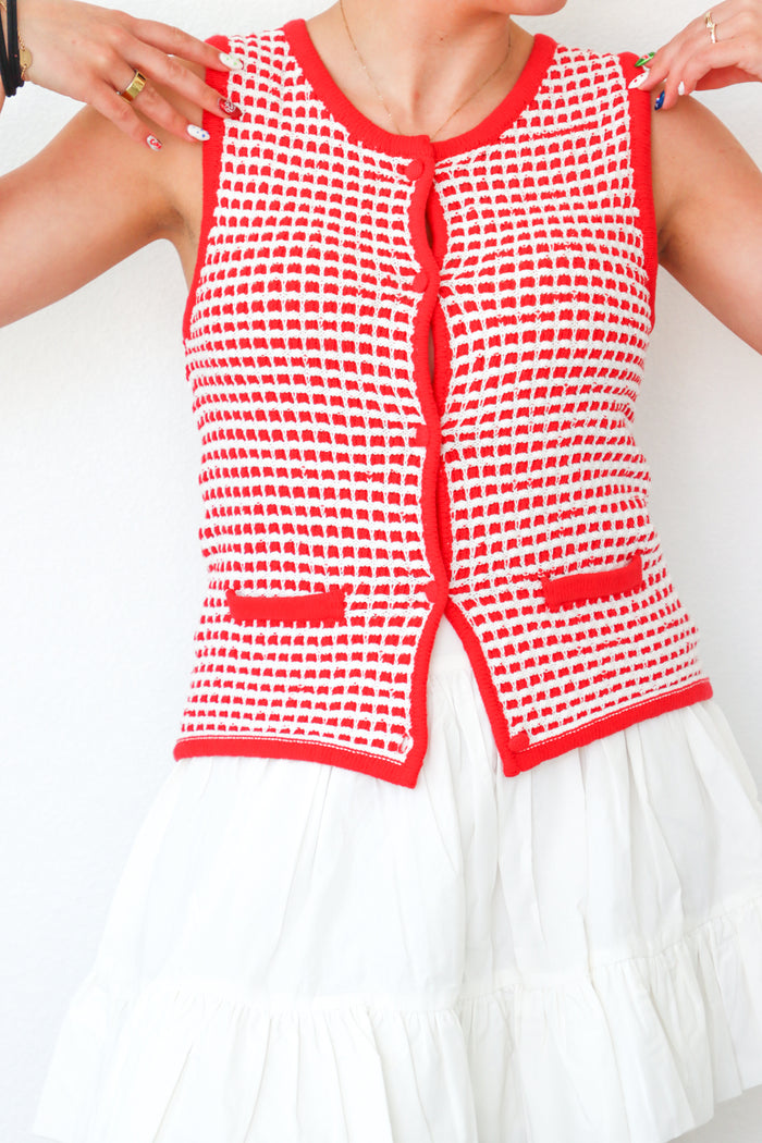 girl wearing red button down knit tank top