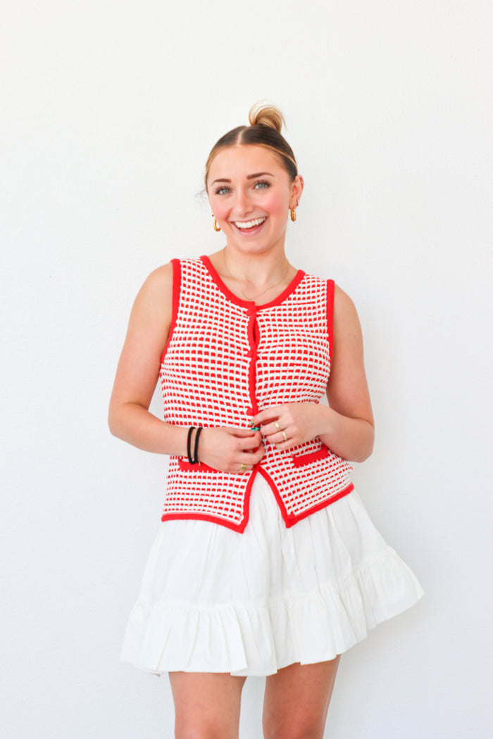 girl wearing red button down knit tank top