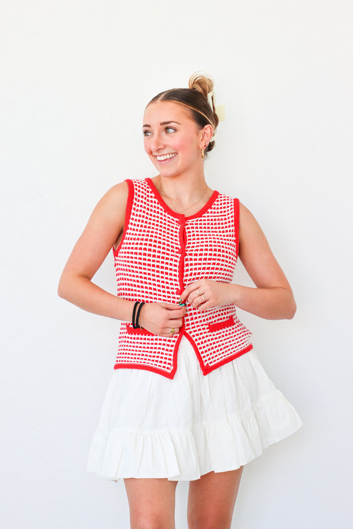 girl wearing red button down knit tank top