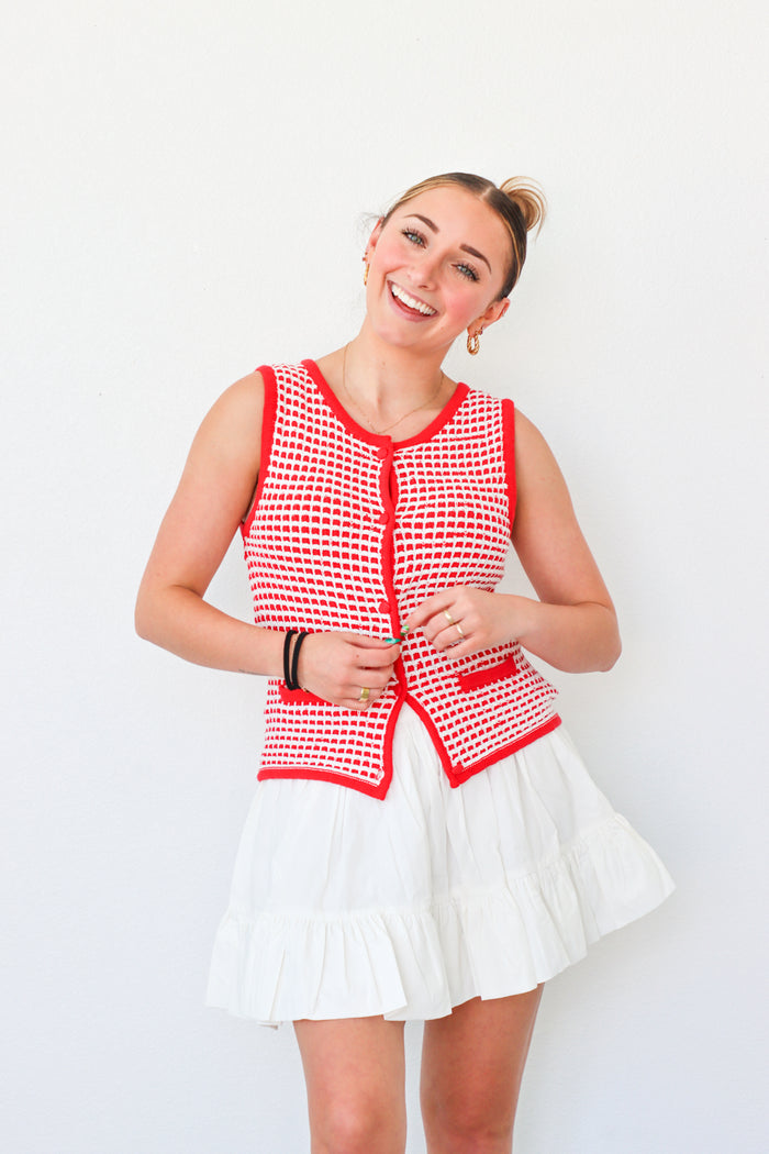 girl wearing red button down knit tank top