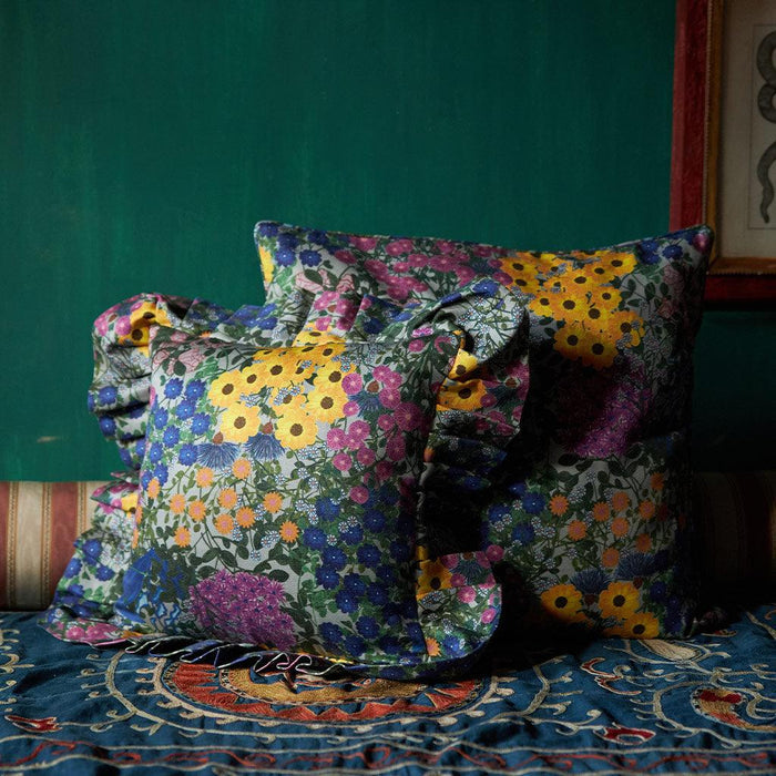 Styled view of the Pré Fleuri Organic Cotton Ruffled Pillow Cover