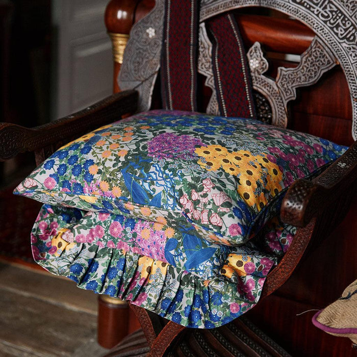 Styled view of the Pré Fleuri Organic Cotton Ruffled Pillow Cover