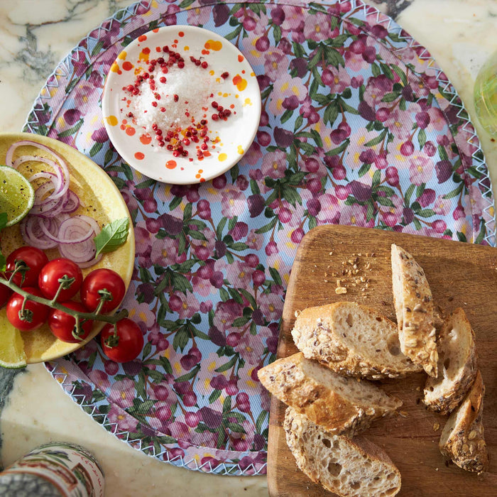 Close-up of the Romance Is Dead Round Cotton Twill Placemats in Blue — Set of 6 print