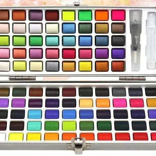 Portable solid watercolor paint set with water brush pen open on watercolor paper