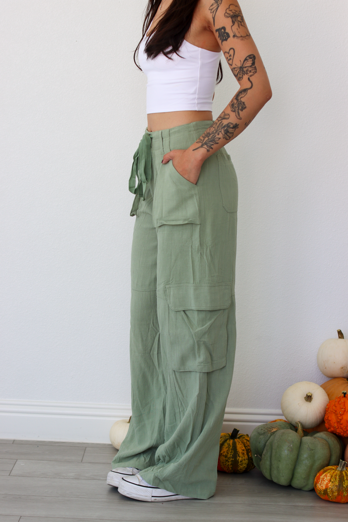Woman wearing green wide leg cargo pants
